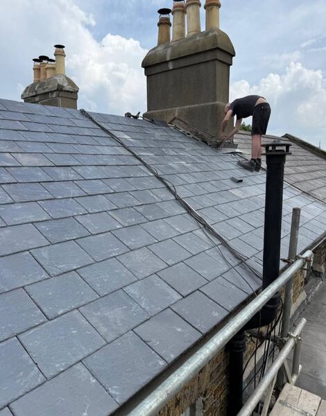 Professional tile roof repair completed by Johnson's Roofing in Salford, Manchester area - High quality clay tiles installation