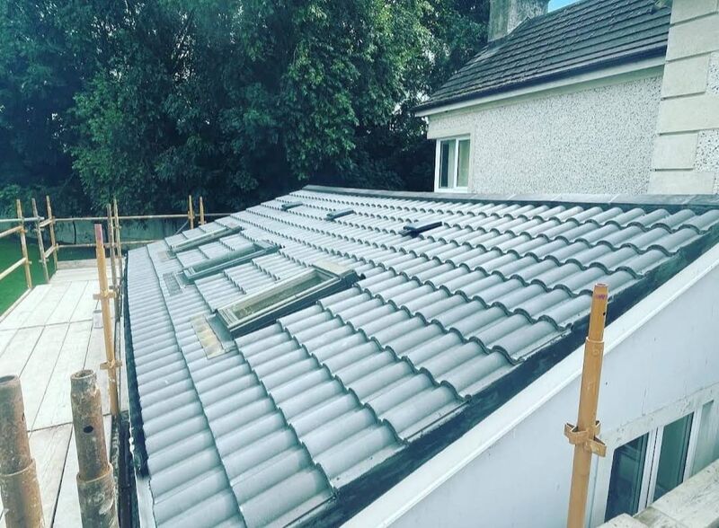 Professional ridge tile replacement completed by Johnson's Roofing in Wigan, Manchester area - High quality cedar shingles installation