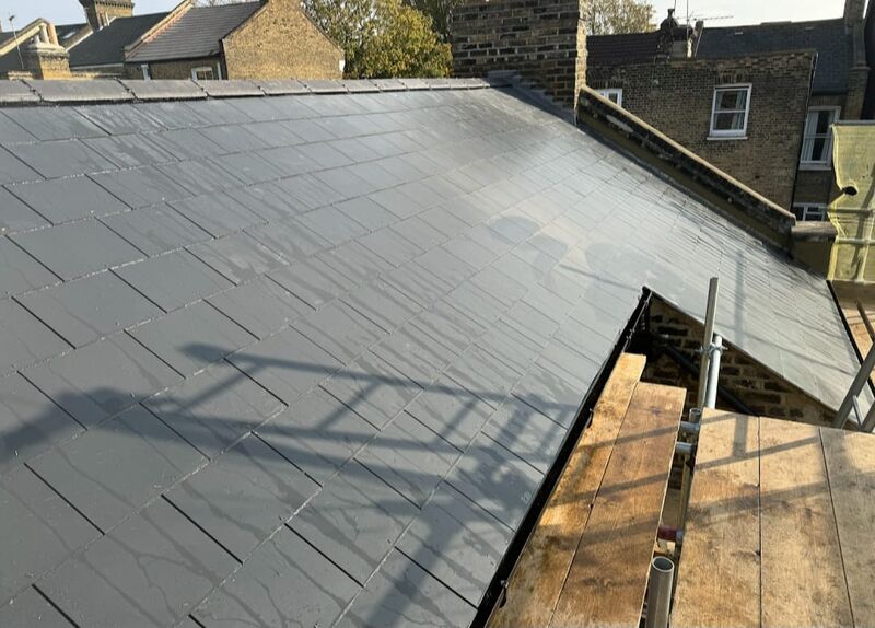 Professional ridge tile replacement completed by Johnson's Roofing in Salford, Manchester area - High quality cedar shingles installation