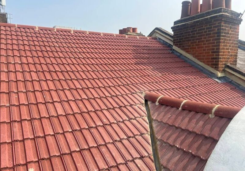 Professional ridge tile replacement completed by Johnson's Roofing in Wigan, Manchester area - High quality cedar shingles installation